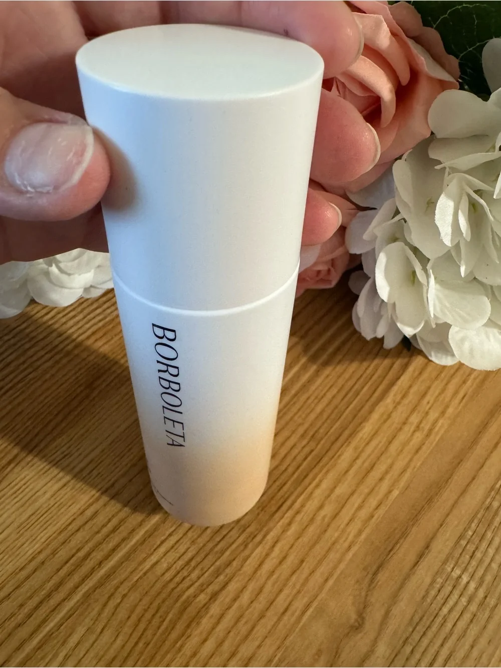 BORBOLETA White Skincare Bottle with Soft Pink Accents